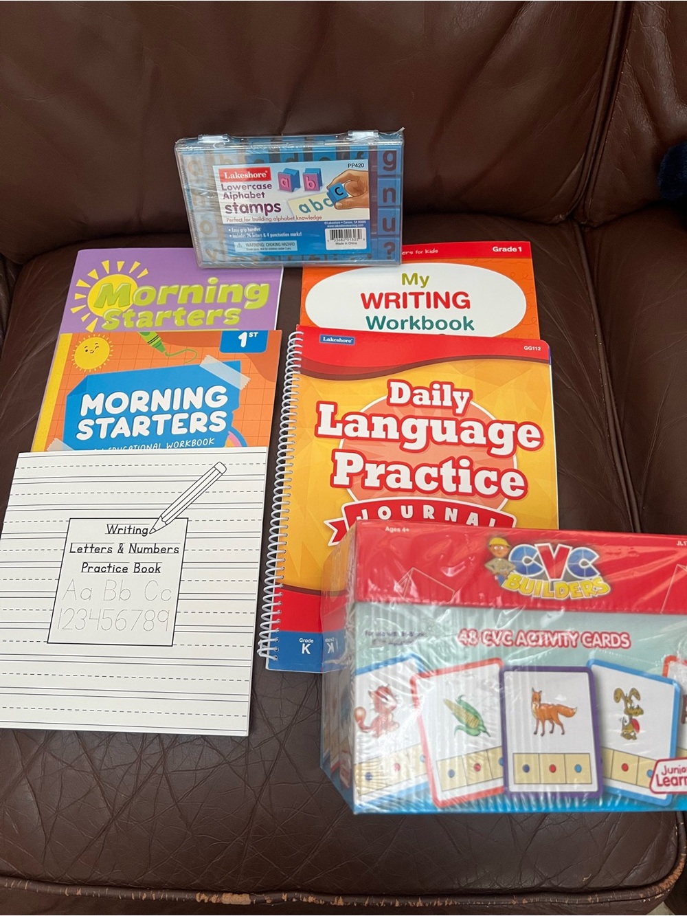 Set of 5 learning books and lowercase alphabet stamps and CVC word builder